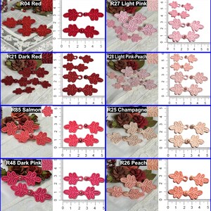 May include: A collection of leaf-shaped fabric embellishments in various colors, including red, pink, and peach. Each piece features a central pearl accent and is displayed with a ruler for size reference. The image showcases a variety of decorative elements.