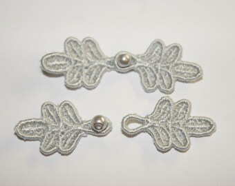 Small Frog Closures 1 3/4", pkg of 2. SILVER #R30. Machine Embroidered.