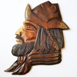 carved wooden man cabesa