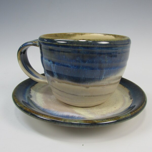 White and blue mug and plate. Cup and saucer