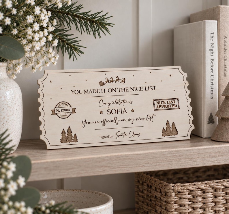 May include: A rectangular wooden plaque shaped like a ticket with scalloped edges, featuring laser-engraved text that reads: YOU MADE IT ON THE NICE LIST, Congratulations SOFIA, You are officially on my nice list, and Signed by: Santa Claus.