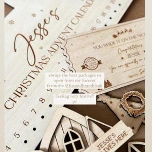 May include: A light-colored wooden Christmas advent calendar with the text Jesse's Christmas Advent Calendar, a rectangular certificate with the text You Made It On The Nice List, and a small wooden house sign labeled Jesse's Elf Lives Here.