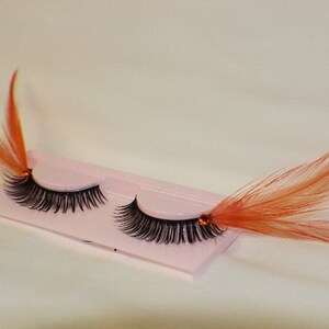 Orange and black feather lashes with orange jewels image 5