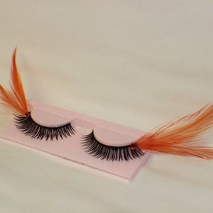 Orange and black feather lashes with orange jewels image 1