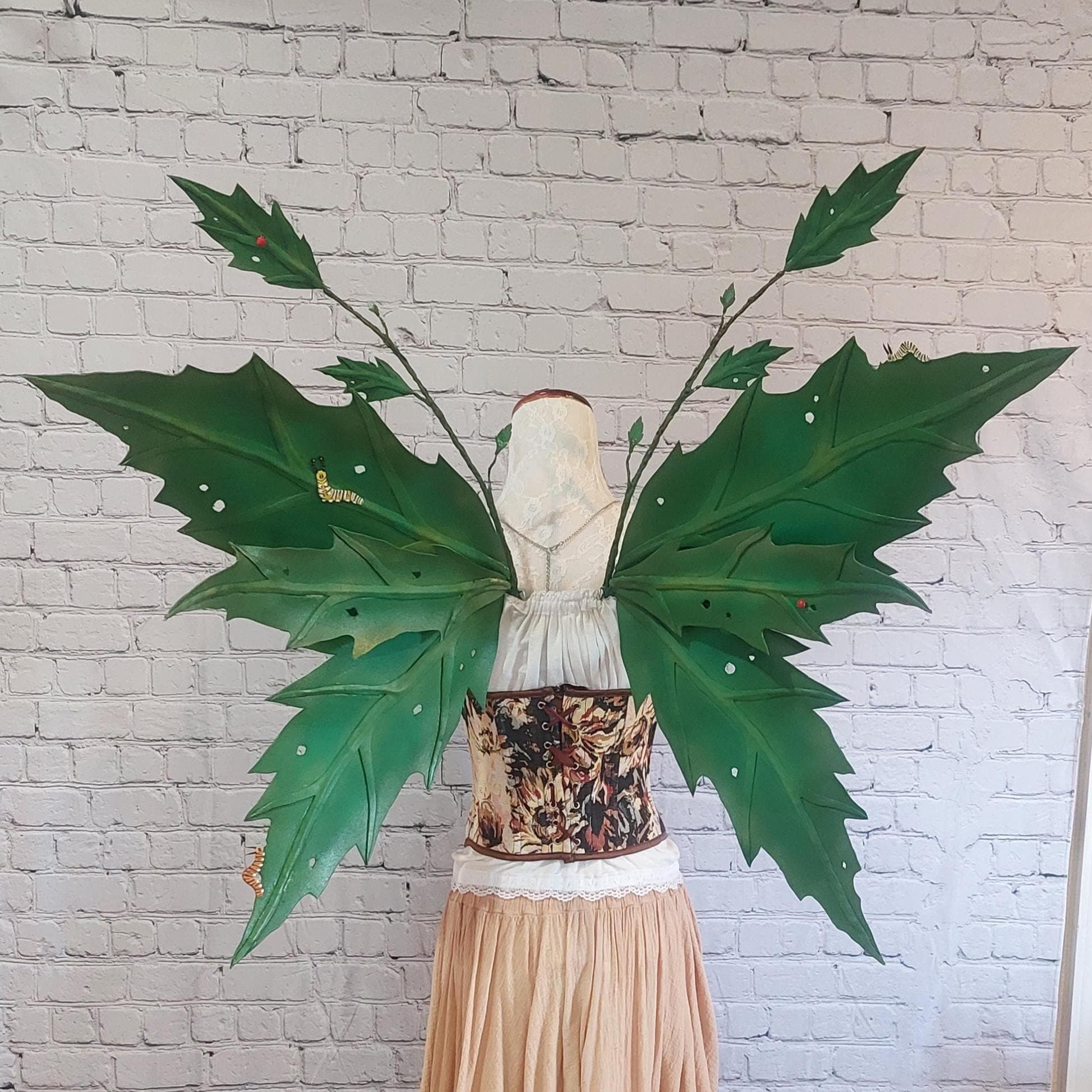 Green hand painted foam Leafy fairy wings with caterpillars and ladybugs