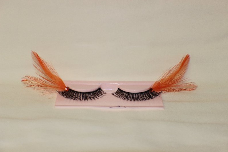 Orange and black feather lashes with orange jewels image 2