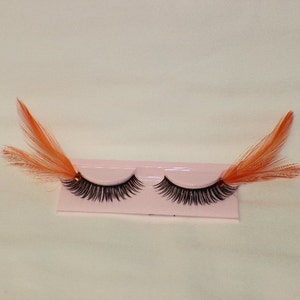 Orange and black feather lashes with orange jewels image 3
