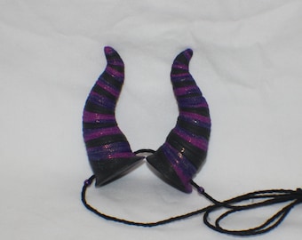 Small black and purple twisted horns