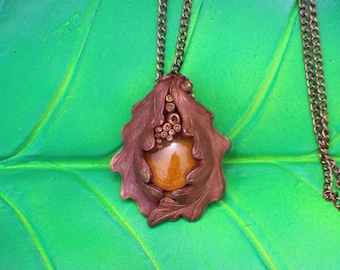 Copper, bronze and gold sculpted clay Oak leaf necklace with a amber gold glass cabochon
