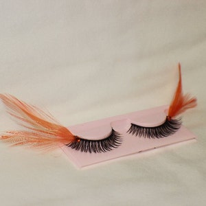 Orange and black feather lashes with orange jewels image 4