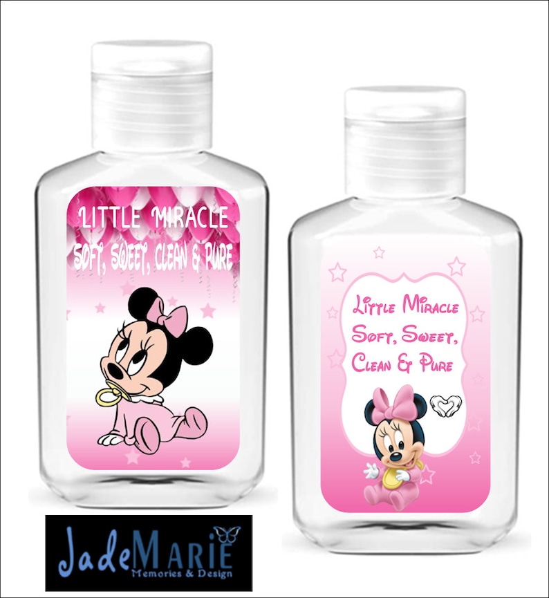 May include: Two clear plastic bottles of hand sanitizer with pink and white labels featuring a cartoon image of Minnie Mouse. The labels read "Little Miracle Soft, Sweet, Clean & Pure".