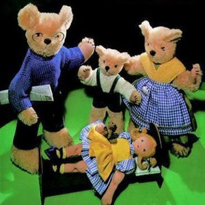 May include: A group of teddy bears in various outfits. One bear wears glasses and a blue sweater, holding a newspaper. Another wears a white sweater and dark overalls. A third bear wears a yellow top and blue gingham skirt. A doll lies on a small bed.
