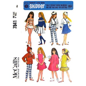 May include: McCall's 7841 sewing pattern for a 9-inch doll. The pattern includes eight different outfits, including a swimsuit, a sweater and skirt, a plaid shirt and pants, a sailor dress, a jacket and pants, a pink dress, a red dress, and a yellow dress. The pattern is for Barbie's Little Sister Skipper and includes instructions for knitting.