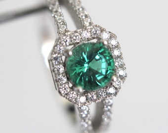 Lab Emerald Green Step Cut Round in a Halo Sterling Silver Ring