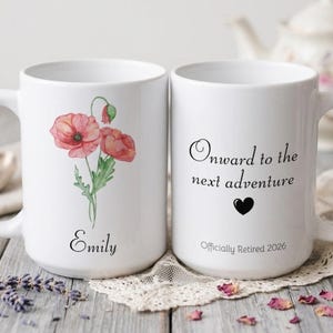May include: Two white ceramic mugs. One mug features a watercolor poppy design with the name "Emily". The other mug has the text "Onward to the next adventure" and a black heart, with "Officially Retired 2026" below.