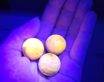 3 large cadmium glass shooting marbles UV reactive glowing glass
