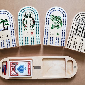 Tablas de cuna de viaje de arce duro.