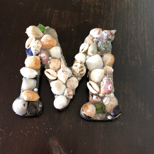 Seashell letter M with sand for grout, rhinestones