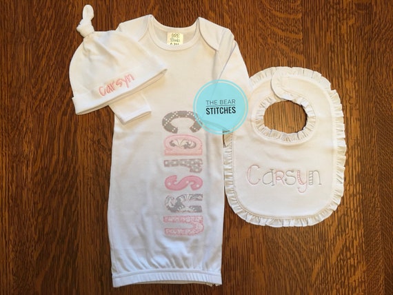white newborn gown and hat