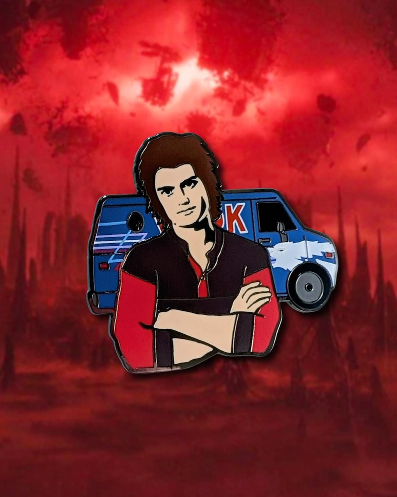 May include: Enamel pin featuring a character with brown hair, wearing a black and red jacket, arms crossed. A blue van with white accents is behind the character. The background is a red, cloudy sky.