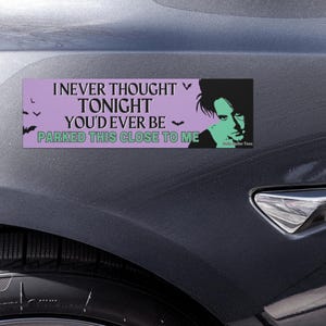May include: A rectangular bumper sticker with the text "I NEVER THOUGHT TONIGHT YOU'D EVER BE PARKED THIS CLOSE TO ME" in white and green on a lavender background. A black and green graphic of a person is on the right side. Bats are also included.