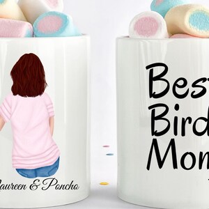 May include: Two white ceramic mugs filled with marshmallows. One mug features an illustration of a person holding a parrot, with the text "Maureen & Pancho." The other mug says "Best Bird Mom" with a bird silhouette.