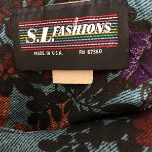 May include: A black fabric label with the text "S.L. FASHIONS" in rainbow colored letters. The label also says "Made in U.S.A." and "RN 57560".