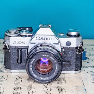 Working Vintage Canon AE-1 35mm Film SLR Camera with Canon Lens -=Bargain=-