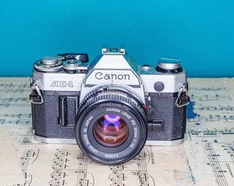Working Vintage Canon AE-1 35mm Film SLR Camera with Canon Lens -=Bargain=-