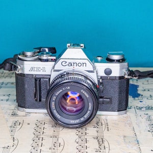 Working Vintage Canon AE-1 35mm Film SLR Camera with Canon Lens -=Bargain=-