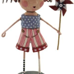 May include: A figurine of a girl with red pigtails wearing a blue and white polka dot top and red and white striped shorts. She is holding a red, white, and blue pinwheel.