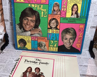 Capa do álbum vintage "Up To Date" da família Partridge, com encarte.