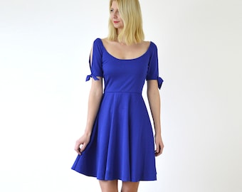 NANETTE | Split Sleeve Skater Dress with Tie-Up Bows in Royal Blue. Midi Circular Skirt Dress with Deep Scoop Neck Cold Shoulder Sleeve