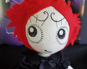 Basic 11-inch Ruby Gloom  doll freestanding. Signature black outfit and black leather mary-jane shoes. Option on Mini Mr.Buns