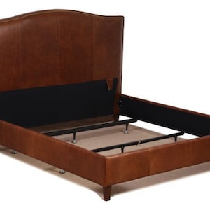 May include: A brown leather bed frame with a curved headboard and a metal slat support system.