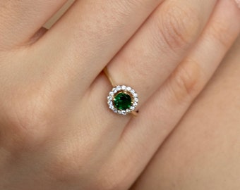 1/2 carats green tourmaline and 1/4 carats natural diamonds in 14 karat gold