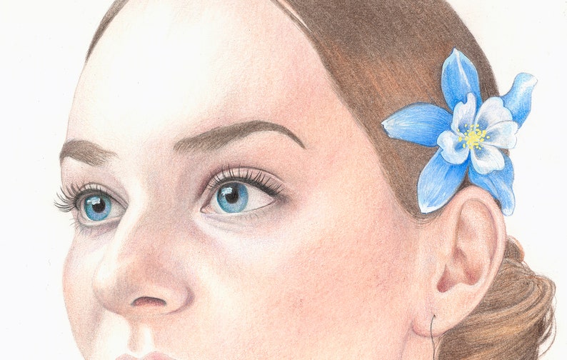 May include: A close-up portrait of a person with blue eyes and brown hair. A blue flower with white petals is tucked behind the person's ear.