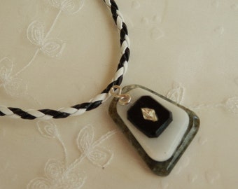 Black and white pendant on cord