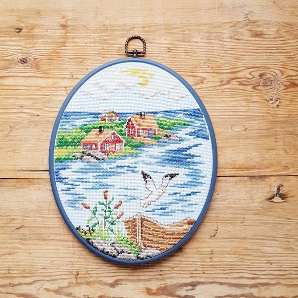 Lovely oval cross stitch embroidered  archipelago motif wall hanging in cotton from Sweden