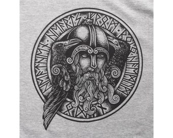 May include: Black and white illustration of a Norse god wearing a horned helmet with two ravens perched on his shoulders. The image is surrounded by a circle of runes.