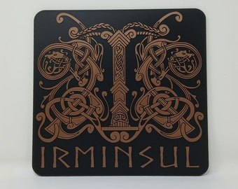 May include: A black square coaster with a copper-colored design of an intricate knotwork pattern. The design features a central pillar with a pointed top and a word "IRMINSUL" at the bottom.