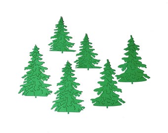 May include: Six green paper cut-out pine trees of varying sizes. The trees are all the same shade of green and have a textured surface.