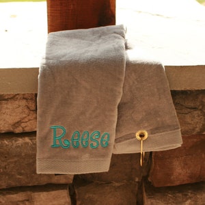 gray golf towel with turquoise embroidered name