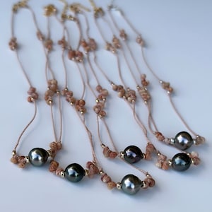 Hand knotted Kahelelani shell and Tahitian pearl necklace in silk