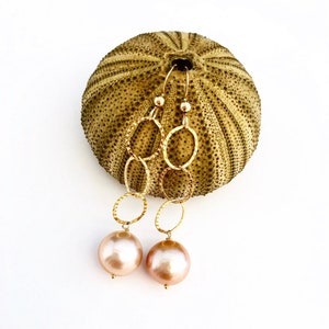Trio of dainty gold hoops featuring edison pearls