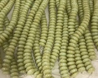 CzechMates Pale Green Turquoise - Star Dust. Lt Green, 2 hole Lentils, 50 beads per strand