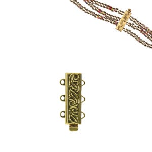 May include: Gold-toned multi-strand necklace clasp with an ornate, engraved design. The clasp has three loops for attaching strands and a matching bar clasp. The necklace strands are made of small, colorful beads.