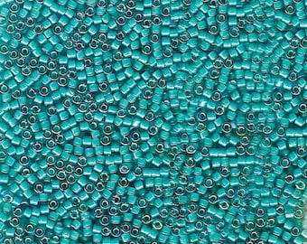 DB-1782 White Lined Teal AB, 11/0 Delica Miyuki Cylinder beads, 7.6 grams approx.