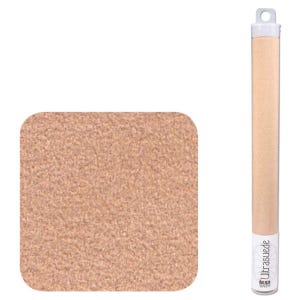 May include: A square of light brown Ultrasuede fabric with rounded corners sits next to a clear tube containing a similar material. The tube has a white cap and a label with the text "Ultrasuede" and "BEAD SMITH".