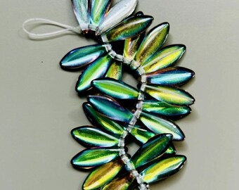 DAGGER 5X16mm BACKLIT UTOPIA 25 1-hole beads per strand